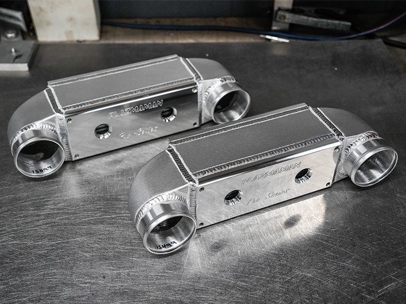 Plazmaman 500 hp compact water-to-air intercooler; shown fittings and finish vary