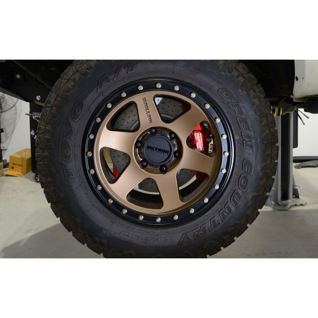 Harrop Ford Ranger front brake upgrade behind off-road wheel