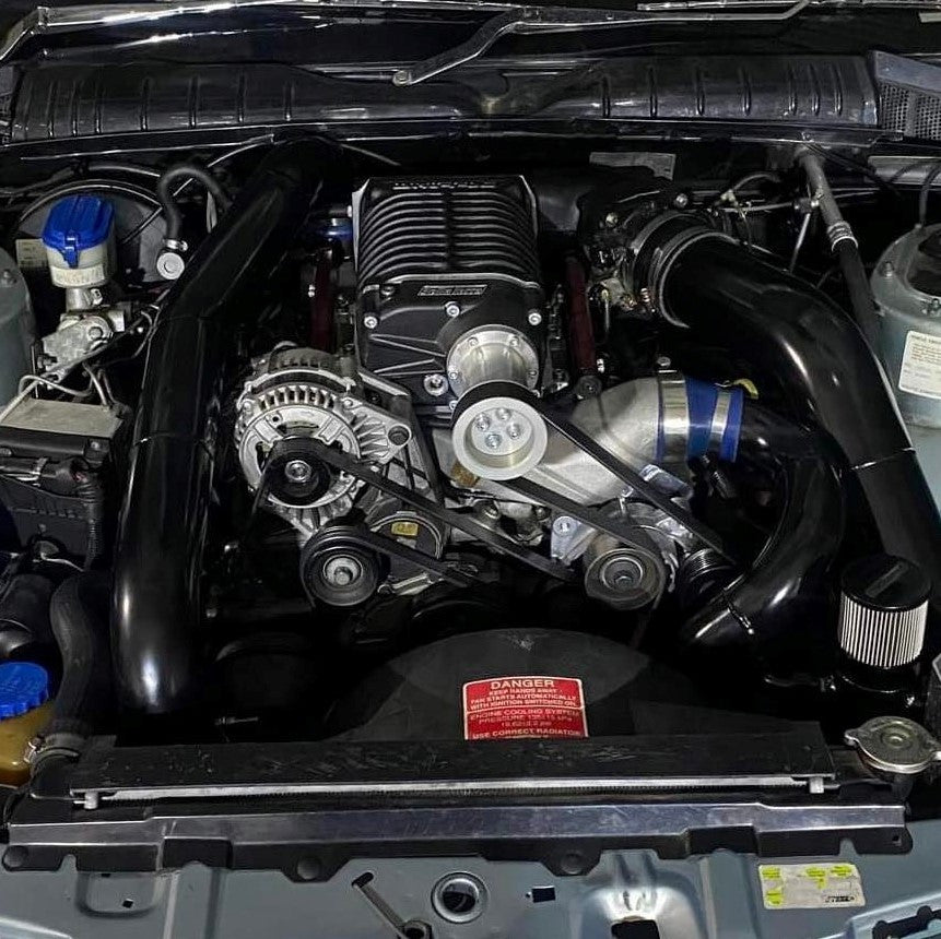 Yella Terra Whipple 2.4L L67 A2A supercharger installed in Holden engine bay