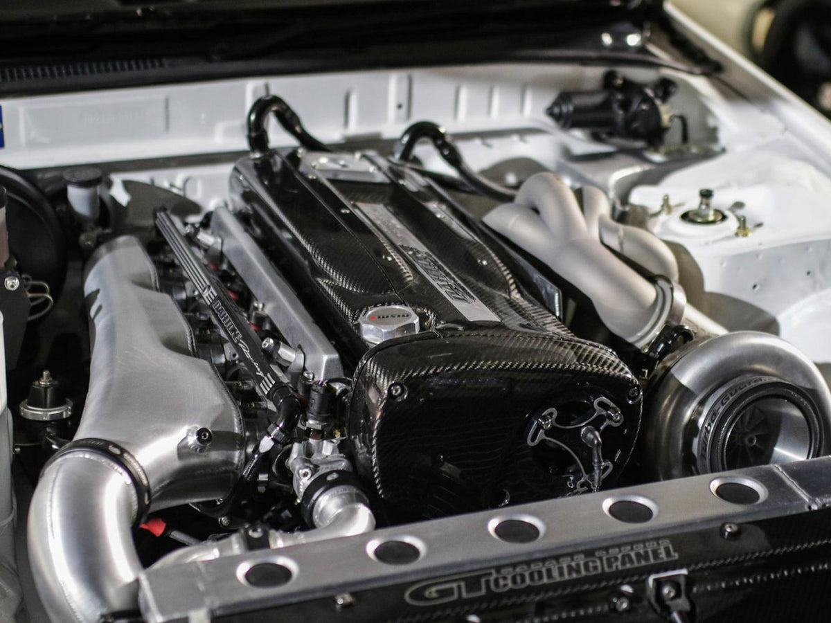 RB26 GT-R individual throttle body inlet plenum using the factory six throttles; photographed finish and equipment vary