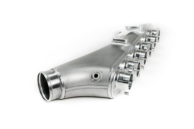 RB26 GT-R individual throttle body inlet plenum using the factory six throttles; photographed finish and equipment vary